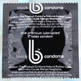 A compact square package of "b Condoms Supreme Black Condoms" from bCondoms features ultra-smooth latex and includes information on the product, as well as warnings about natural rubber latex and STI protection. The primarily black packaging emphasizes white text, reassuring users that each condom undergoes triple testing for safety.